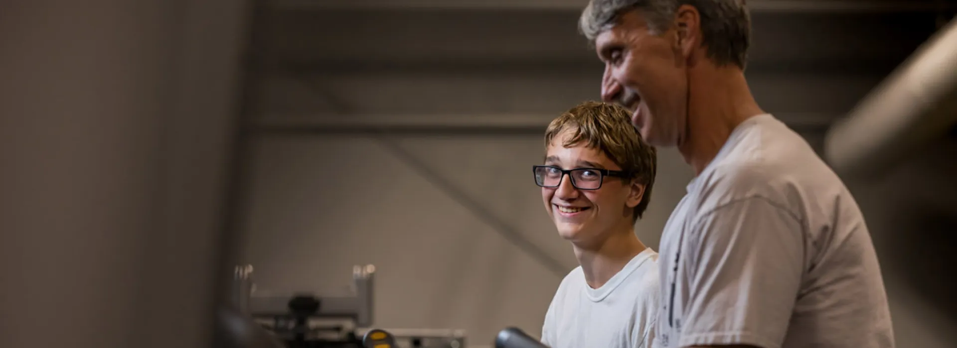 father and son on treadmill at YMCA Pittsburgh